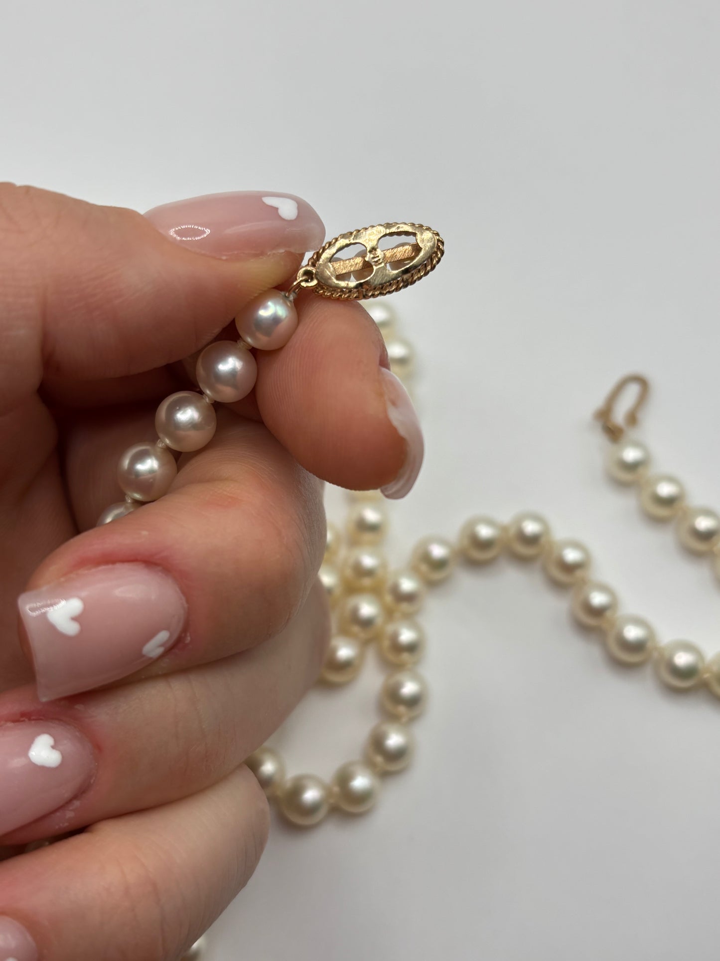 Long 24” vintage pearl necklace with 14k yellow gold clasp