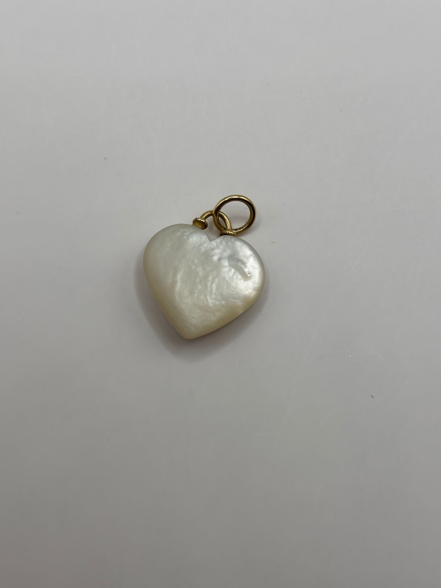 Heart shaped pearl with emerald detail